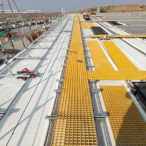 FRP walkway grating installed with yellow railing
